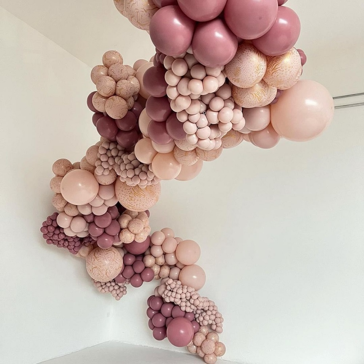 Balloon garland with inflated pink blush balloons