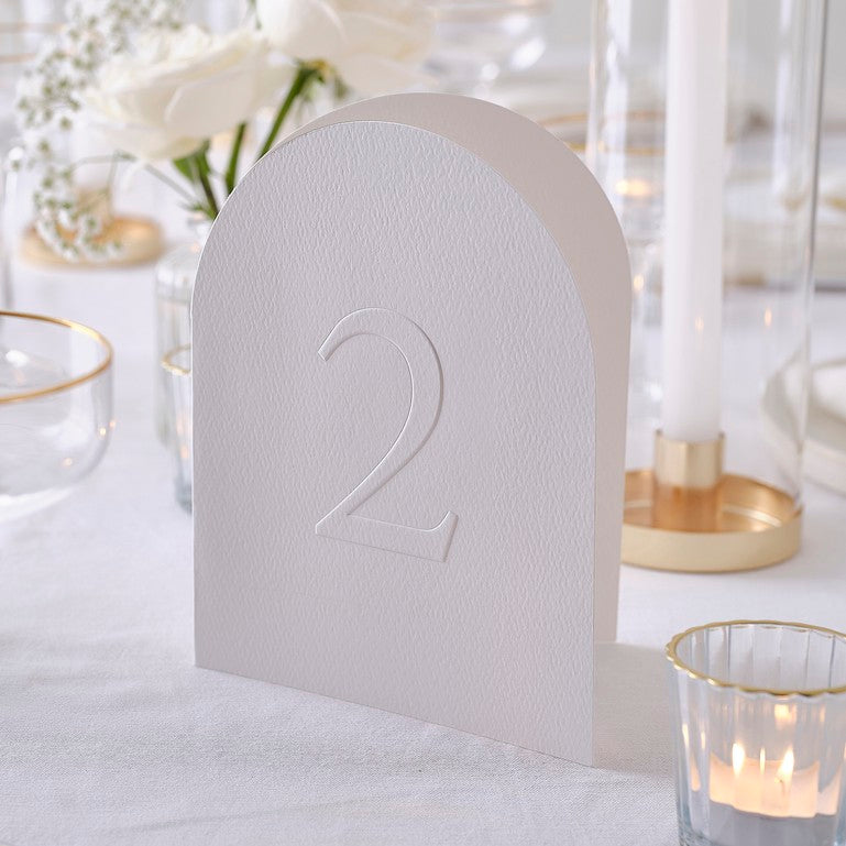 White embossed card table numbers 